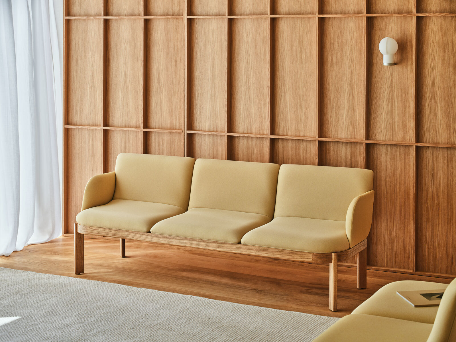 Ramp three seater designer sofa with oak frame